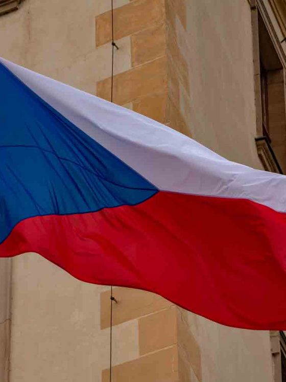 A picture of the Czech Republic flag hanging on a building