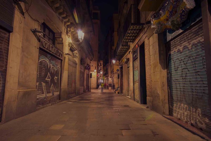 night view of street with closed cannabis club in barcelona